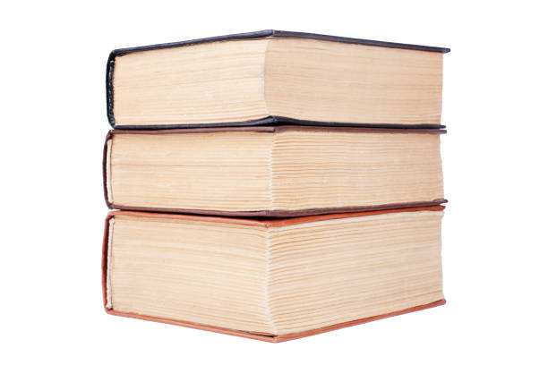 istock Three closed old thick paper books with yellow pages white background isolated close up, book heap, pile, stack, vintage hardcover textbooks, education symbol, read & study sign, library literature 1271627608