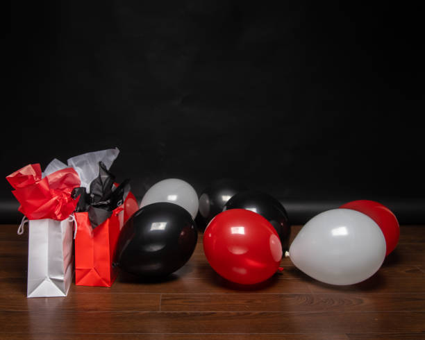 istock Red, White, and Black Balloons with a Black Backdrop 1271631244