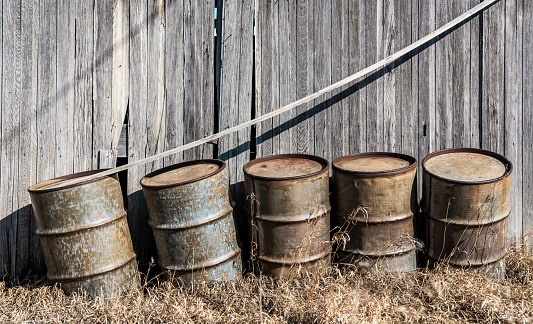 Discarded oil drum cans at backyard, SK, Canada.
