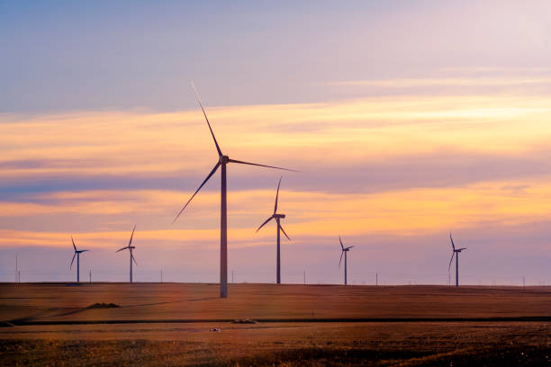istock Wind turbines silhouette on sunset 1271632301