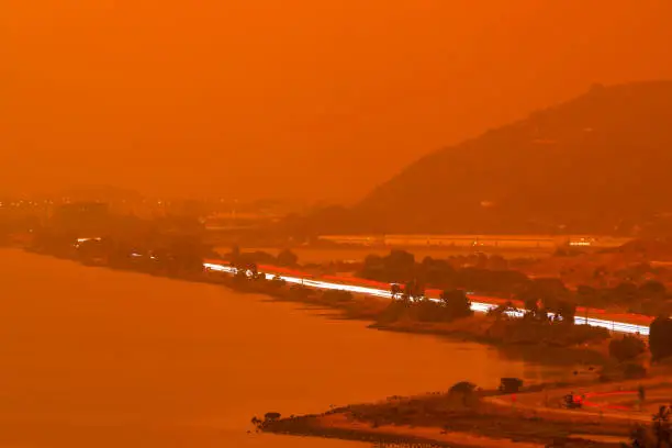Photo of Orange haze over San Francisco Bay on September 9 2020 from record wildfires in Californa, ash and smoke during daytime