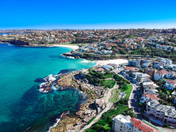 Panoramic Aerial Drone view of Bondi Beach Sydney Australia Panoramic Aerial Drone view of Bondi Beach rock cliff houses Sydney Australia bondi beach photos stock pictures, royalty-free photos & images