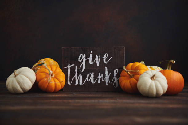 istock Fall Thanksgiving background with pumpkin assortment and message of thanks 1271638932
