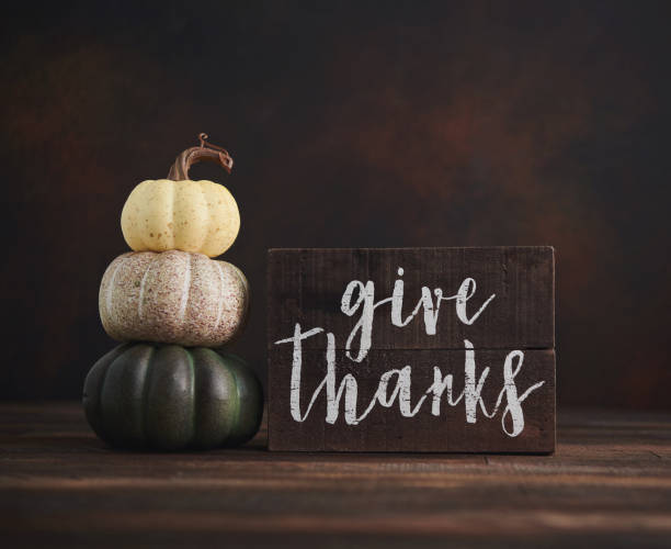 istock Fall Thanksgiving background with pumpkin stack and message of thanks 1271638941