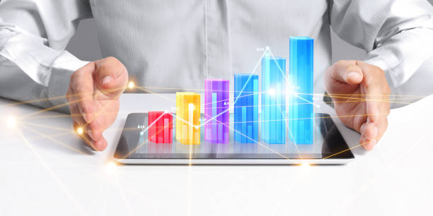 istock Businessman plan graph growth  increase of chart positive indicators in his business, tablet in hand 1271639018