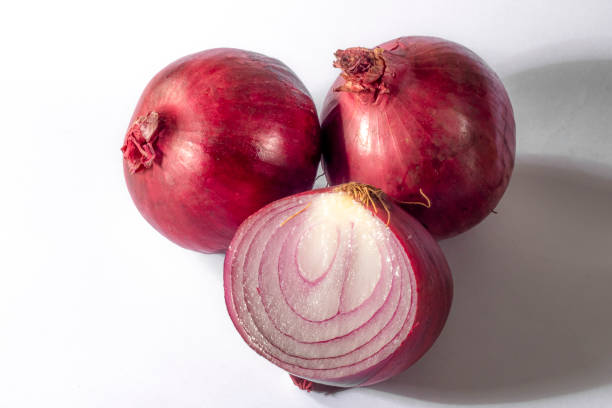 Red onions on white background in Brazil