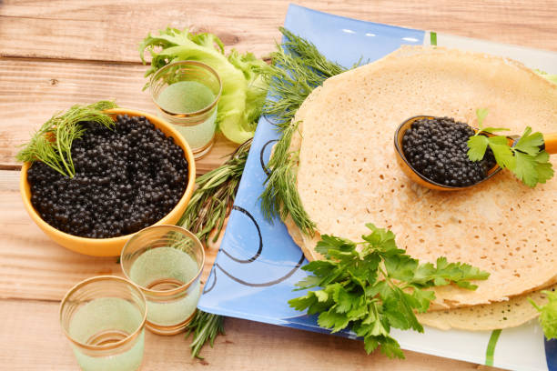 istock Pancakes with black caviar 1271643427