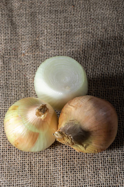 istock yellow onion on jute background in Brazil 1271643571