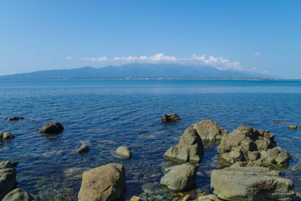 Sado Island Mountains of Sado on the opposite bank seen from the coastline Sado stock pictures, royalty-free photos & images