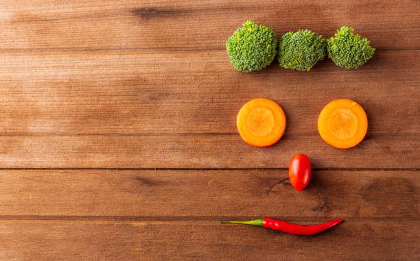istock happy fresh organic vegetable and fruit face smiling 1271649315