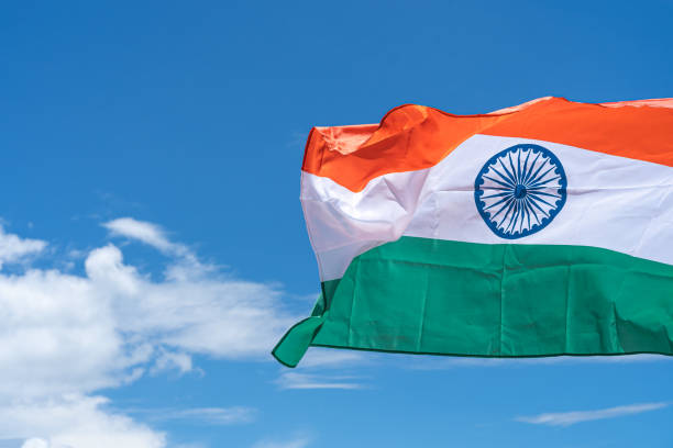 istock Waving India flag under blue sky background. 1271650261