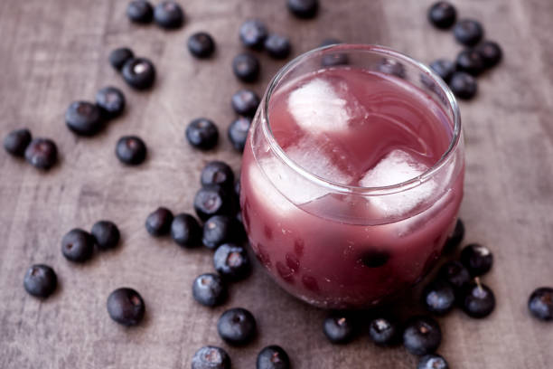 istock Fresh made Blueberry Smoothie on wooden background 1271651113