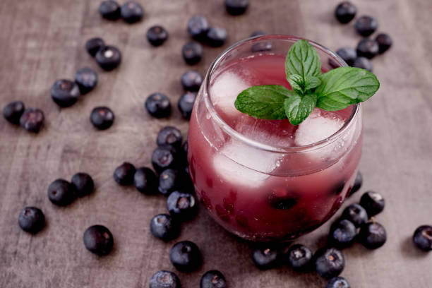 istock Fresh made Blueberry Smoothie on wooden background 1271651116