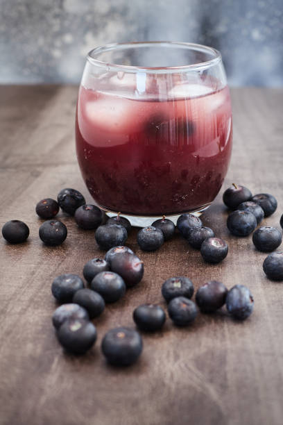 istock Fresh made Blueberry Smoothie on wooden background 1271651118