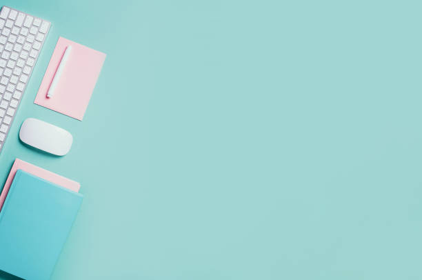 istock White mouse, keyboard, notebook, pen on blue background. Top view. Copy space. Flat lay. Remote job, work. Home office workspace. Feminine workspace. Blogger, business concept. Mock up 1271654494