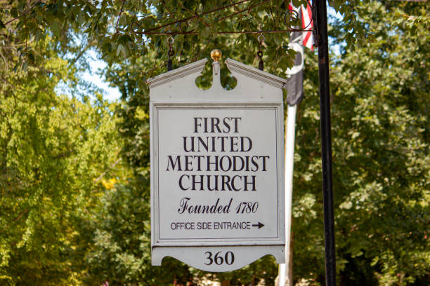 First United methodist Church in Chestertown, MD Chestertown, MD 08/30/2020: A wooden board street sign showing the direction of the First United Methodist Church (a historic landmark built on 1782) in downtown Chestertown. chestertown stock pictures, royalty-free photos & images