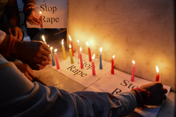 People Using Candles in a Protest Against Rapes in India Rising rate of crime against women in India is one of the major concerns sexual assault stock pictures, royalty-free photos & images