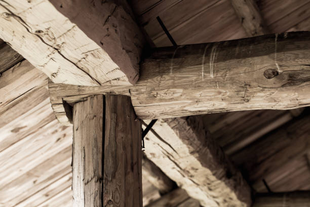 istock Old wooden roof Internal construction. Rough logs 1271661083