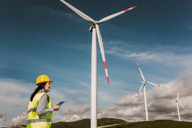 istock Windmill engineers inspection and progress check wind turbine 1271663582