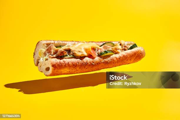 Flying Chicken Sandwich On Yellow Background Stock Photo - Download Image Now - Sandwich, Subway, Food
