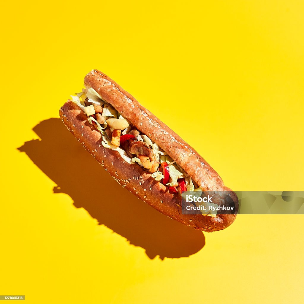 Vegetarian sandwich with sesame bun Sandwich levitation on yellow background. Minimal creative food concept. Vegetarian sandwich with sesame bun Subway Stock Photo