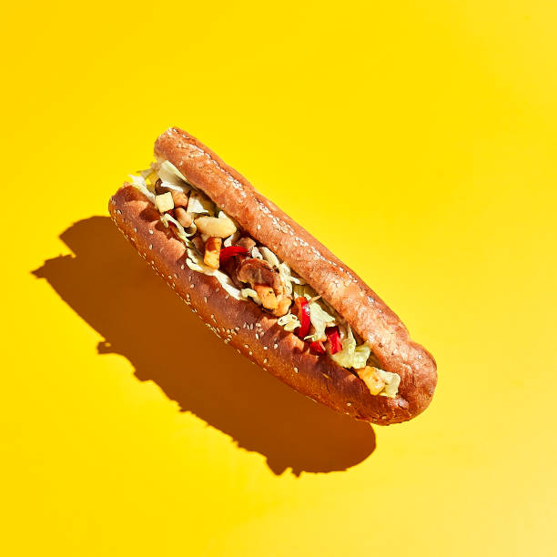 Vegetarian sandwich with sesame bun Sandwich levitation on yellow background. Minimal creative food concept. Vegetarian sandwich with sesame bun subway photos stock pictures, royalty-free photos & images