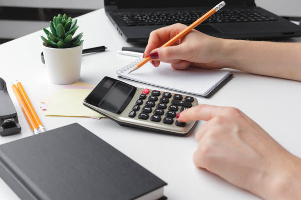 istock Business woman working with financial data hand using calculator 1271668089
