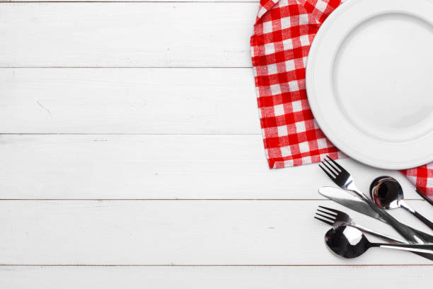 istock Empty plate and towel over wooden table background. 1271668209