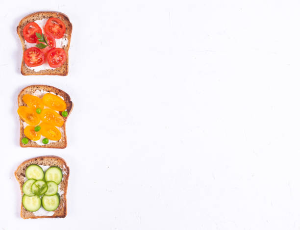 istock Breakfast sandwiches with vegetable veggie toppings and cream cheese on white background 1271669062