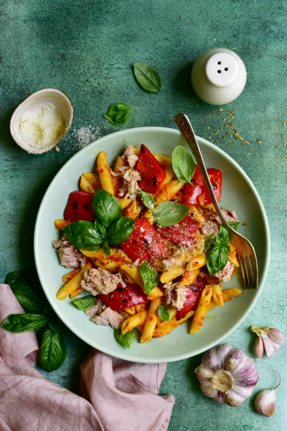 istock Pasta penne with tuna and vegetables in tomato sauce 1271669517