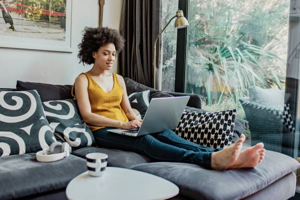 istock A mixed race woman is using laptop at home 1271670562