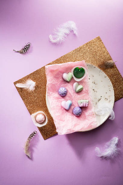 istock Chocolate candies set on white plate top view 1271670612