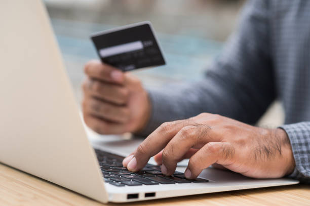 istock Businessman hand holding credit card and using laptop computer to Financial administration. Shopping online, Internet banking concept. 1271672256