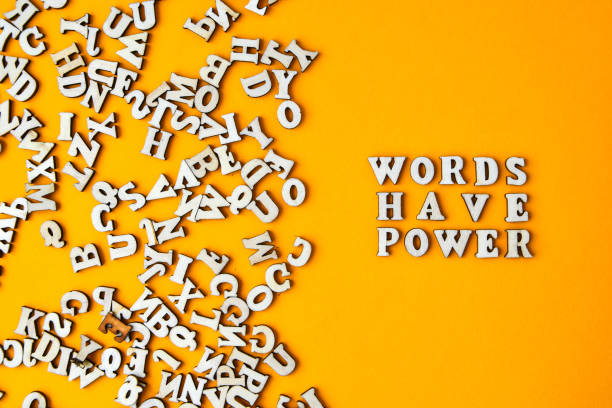 quote words have power made out of wooden letters on bright yellow background. - have imagens e fotografias de stock