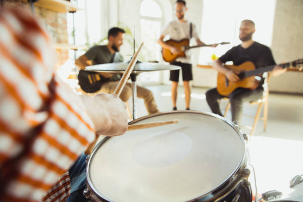 istock Musician band jamming together in art workplace with instruments 1271673087