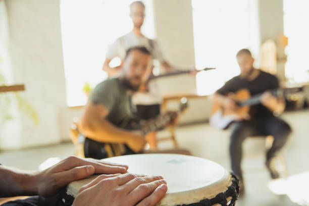 istock Musician band jamming together in art workplace with instruments 1271673104