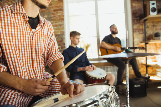 istock Musician band jamming together in art workplace with instruments 1271673165