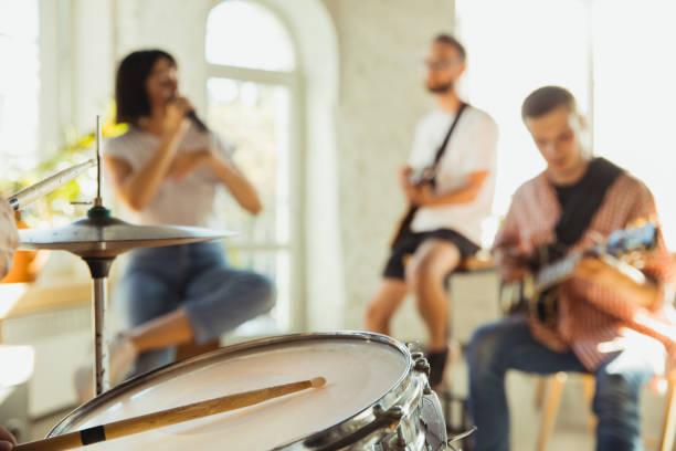 istock Musician band jamming together in art workplace with instruments 1271673171