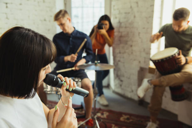 istock Musician band jamming together in art workplace with instruments 1271673186