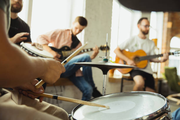 istock Musician band jamming together in art workplace with instruments 1271673206