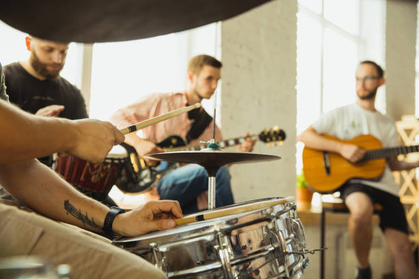 istock Musician band jamming together in art workplace with instruments 1271673210
