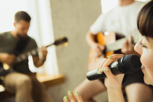 istock Musician band jamming together in art workplace with instruments 1271673224