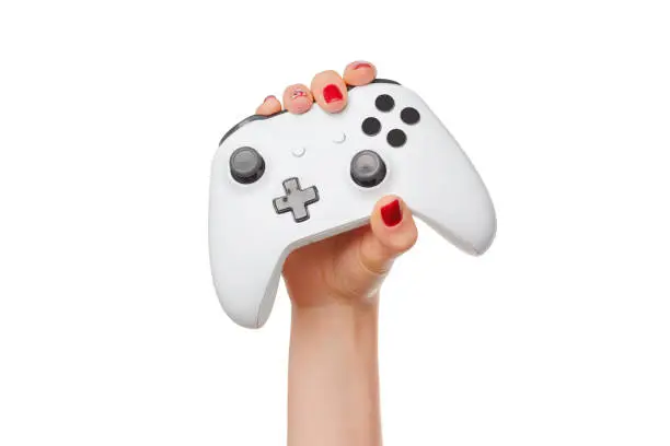 Photo of Video game console controller in gamer hands isolated on white background