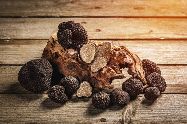 istock Whole and slices black truffle mushrooms 1271673943