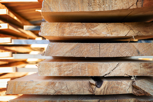 Closeup of cut wooden boards at the woodworker workshop, carpenter work