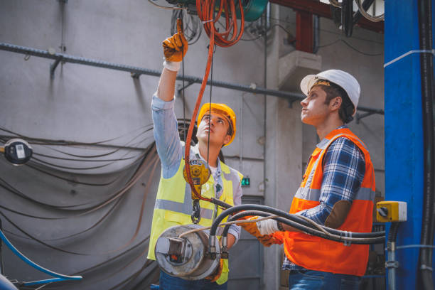 istock Industrial machinery male employees working with remote control for operating crane 1271677897