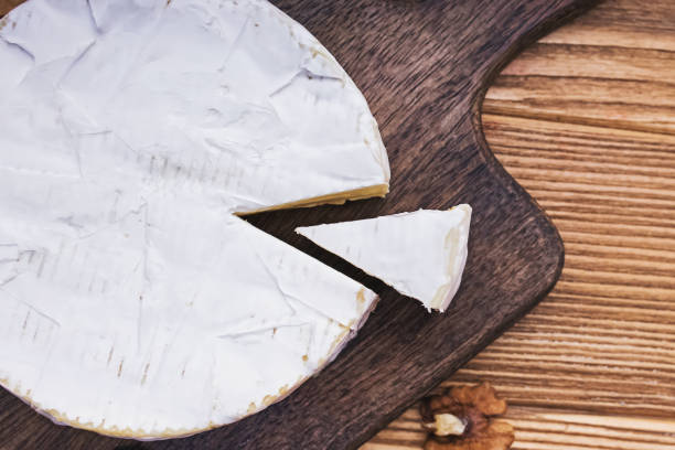 istock Delicious soft camambert cheese on wooden board 1271678543