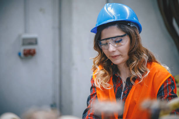 istock Young woman working in factory 1271678659