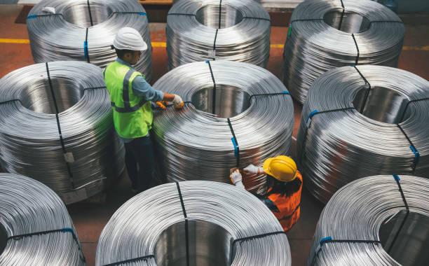 istock Young industry employees checking production line in wire warehouse 1271679752