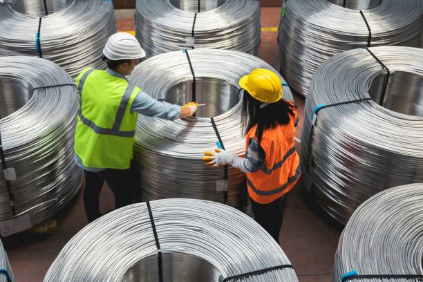 istock Young industry employees checking production line in wire warehouse 1271679829